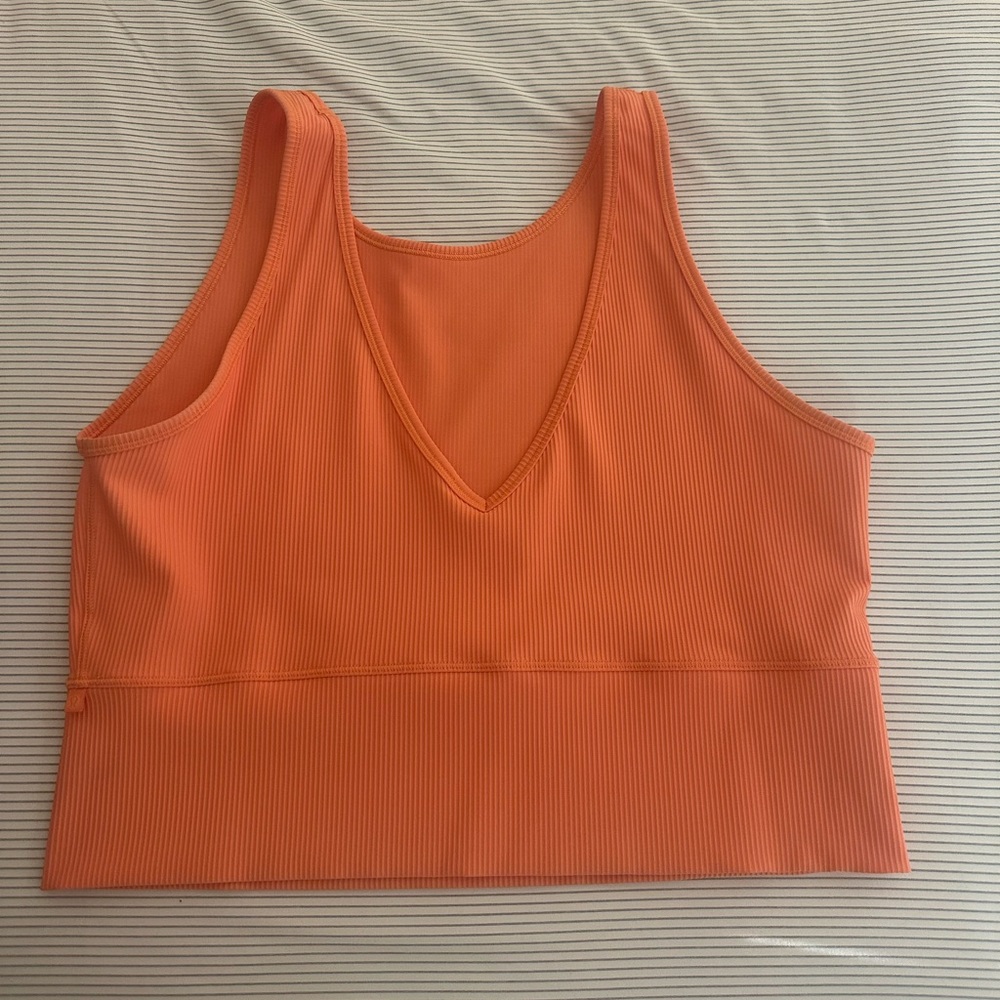 Lululemon size 14 orange tank form fitting